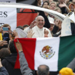 Pope Francis passes Mexico’s flag as he arrives to lead general audience in St. Peter’s Square at Vatican