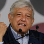 Mexican politician Andres Manuel Lopez Obrador,  leader of the National Regeneration Movement (MORENA) gestures as he addresses the audience during a meeting at Plaza Zaragoza in Monterrey, Mexico